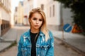 Beautiful young stylish blond woman in a trendy jeans jacket