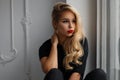 Beautiful young stylish model girl with red lips in a fashion