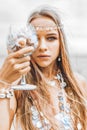 Beautiful young stylish woman close up portrait with glass full of sea shells Royalty Free Stock Photo