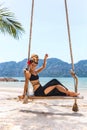 Beautiful young stylish woman having fun at the beach Royalty Free Stock Photo