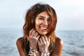 Beautiful young stylish woman having fun on the beach at sunset Royalty Free Stock Photo