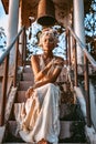 Beautiful young stylish woman wearing flowers wreath outdoors portrait Royalty Free Stock Photo