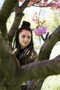 young teen girl in spring blooming cherry blossoms garden Royalty Free Stock Photo