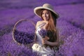 Beautiful young teen girl in hat with basket flowers harvesting Royalty Free Stock Photo