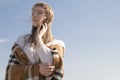 Beautiful young teenage caucasian woman in a plaid walking think Royalty Free Stock Photo