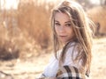 Beautiful young teenage caucasian woman in a plaid walking think Royalty Free Stock Photo