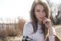 Beautiful young teenage caucasian woman in a plaid walking think Royalty Free Stock Photo