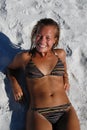 Beautiful young teenage girl laying on beach Royalty Free Stock Photo