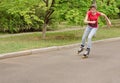 Beautiful young teenage girl roller skating Royalty Free Stock Photo