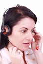Beautiful young telephonist speaking on a headset Royalty Free Stock Photo