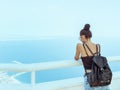 Beautiful young tourist girl with backpack near sea Royalty Free Stock Photo