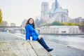 Beautiful young tourist in Paris on a fall day Royalty Free Stock Photo