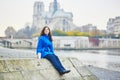 Beautiful young tourist in Paris on a fall day Royalty Free Stock Photo