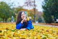 Beautiful young tourist in Paris on a fall day Royalty Free Stock Photo