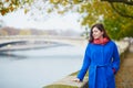 Beautiful young tourist in Paris on a fall day Royalty Free Stock Photo