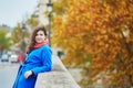Beautiful young tourist in Paris on a fall day Royalty Free Stock Photo