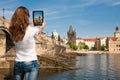Beautiful young tourist woman photographing sites in Prague Czech republic, central europe Royalty Free Stock Photo