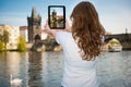 Beautiful young tourist woman photographing sites in Prague Czech republic, central europe Royalty Free Stock Photo