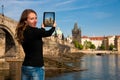 Beautiful young tourist woman photographing sites in Prague Czech republic, central europe Royalty Free Stock Photo