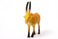 Beautiful young toy unicorn stands on a white background