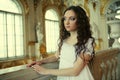 Beautiful young victorian lady in white dress