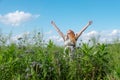 Beautiful young vital woman enjoying in nature in the fresh air. Joy. Freedom. Happiness. Lust raises her arms Royalty Free Stock Photo