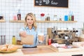 beautiful young waitress holding coffee to go and take away food Royalty Free Stock Photo