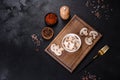 Beautiful young white champignons torn to slices on a dark concrete background Royalty Free Stock Photo