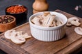 Beautiful young white champignons torn to slices on a dark concrete background Royalty Free Stock Photo