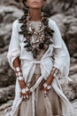 Beautiful young wild free woman in tribal costume with primal ornamet on skin