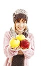 Beautiful young woman with apple. Winter style.