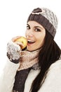 Beautiful young woman with apple. Winter style