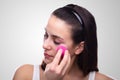 Woman Applying Makeup With Sponge