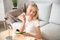 Beautiful young woman applying mask with aloe vera extract at home Royalty Free Stock Photo