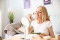 Beautiful young woman applying mask with aloe vera extract at home Royalty Free Stock Photo