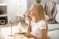 Beautiful young woman applying mask with aloe vera extract at home Royalty Free Stock Photo