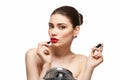 Girl applying red lipstick isolated on white Royalty Free Stock Photo