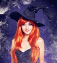Beautiful young woman as halloween witch