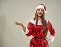 Beautiful Santa helper on gray background Royalty Free Stock Photo