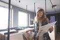 Beautiful young woman audiophile is browsing vinyl records in a store