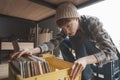 Beautiful young woman audiophile is browsing vinyl records in a store