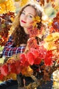 Beautiful young woman in autumn grape vineyard