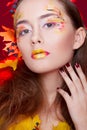 Beautiful young woman with autumn make up holding apples in her Royalty Free Stock Photo