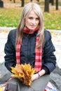 Beautiful young woman in autumn park