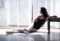 Beautiful young woman ballet dancer sitting on the floor Royalty Free Stock Photo