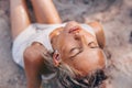 Beautiful young woman on the beach close up portrait