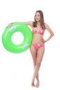 Beautiful young woman in bikini posing with a big green rubber ring Royalty Free Stock Photo