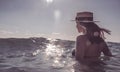 Beautiful young woman in bikini on the sunny tropical beach relaxing in water Royalty Free Stock Photo