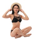 Beautiful young woman in black bikini with hat on white Royalty Free Stock Photo