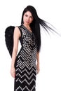 Beautiful young woman in a black dress with black angel wings Royalty Free Stock Photo